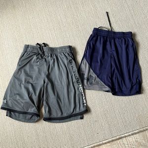 Set of boys’ Under Armour performance shorts - one size YL and the other is YS